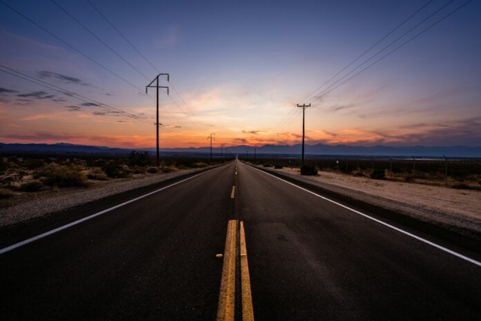 Photo by Gilberto Parada empty road during golden hour