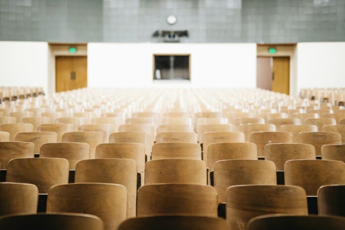 Photo by Nathan Dumlao empty chairs in theater