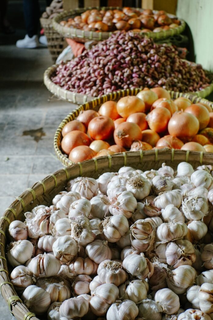 Photo by Keriliwi orange and red tomatoes on brown woven basket