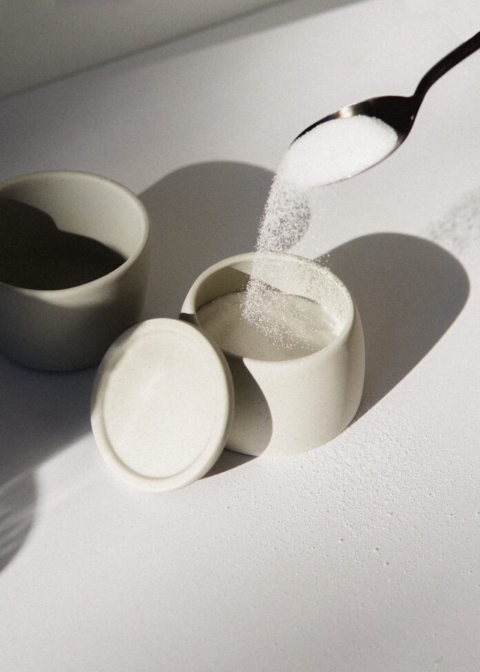 Photo by Mathilde Langevin white ceramic mugs on white table