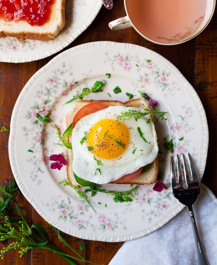 Photo by Joseph Gonzalez sunny-side up egg with bread beside fork