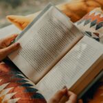 현대인의 휴대폰 과다 사용, 건강에는 어떤 영향? 실천 가능한 생활관리법 소개 person reading book on brown and beige textile